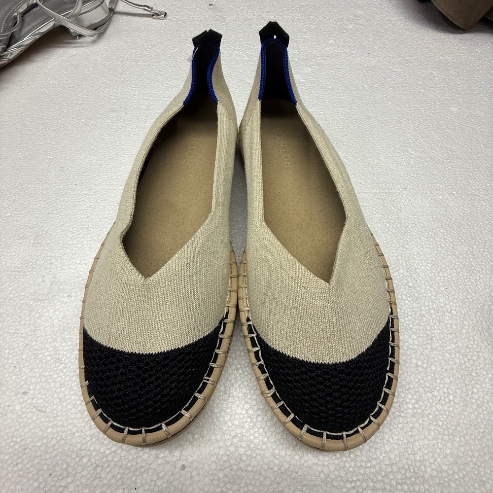 Rothy's The Espadrille Boardwalk shoes in a cream and black colorway.